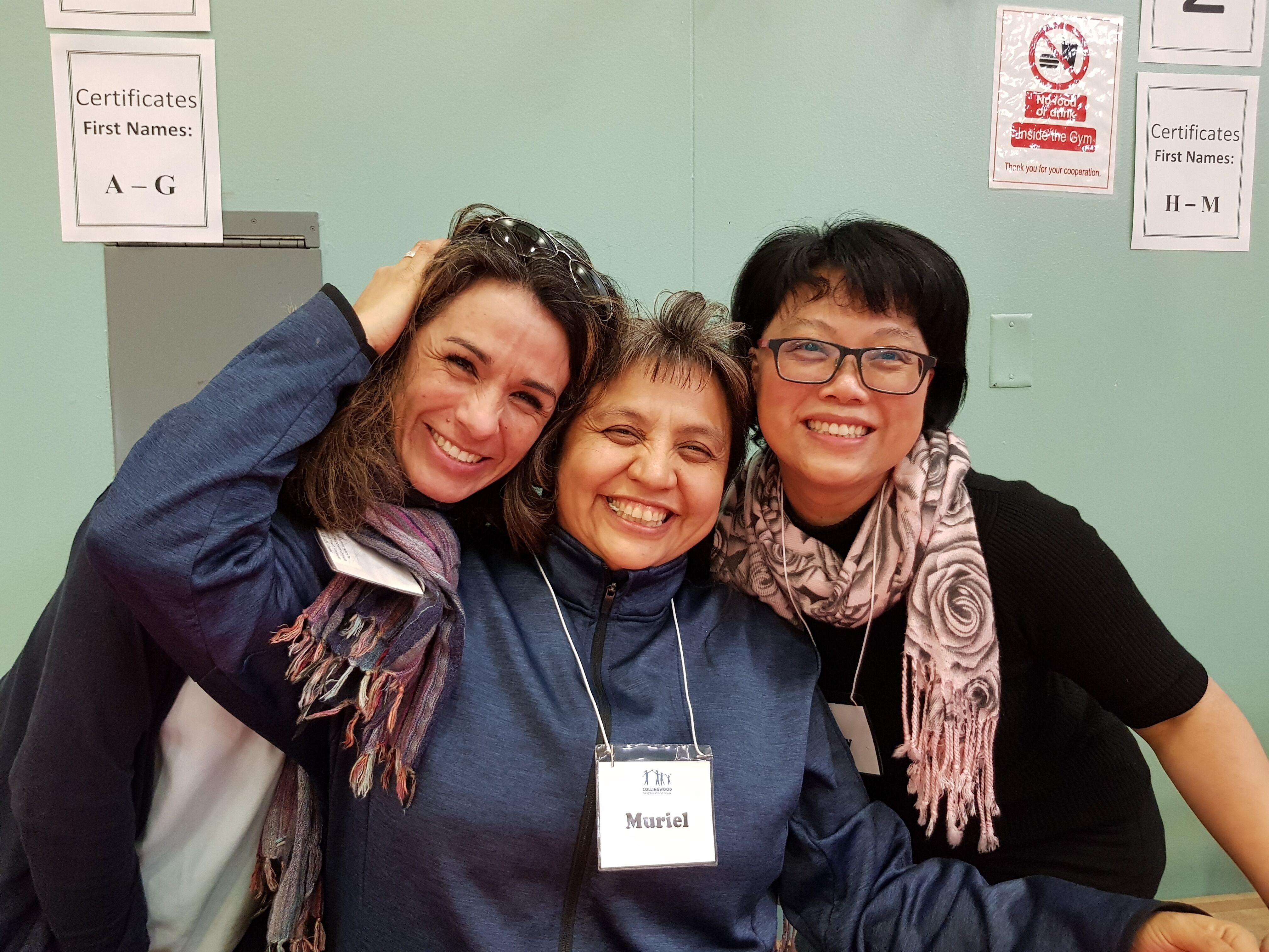 CNH Staff, Sandra, Muriel and Jenny embracing each other closely