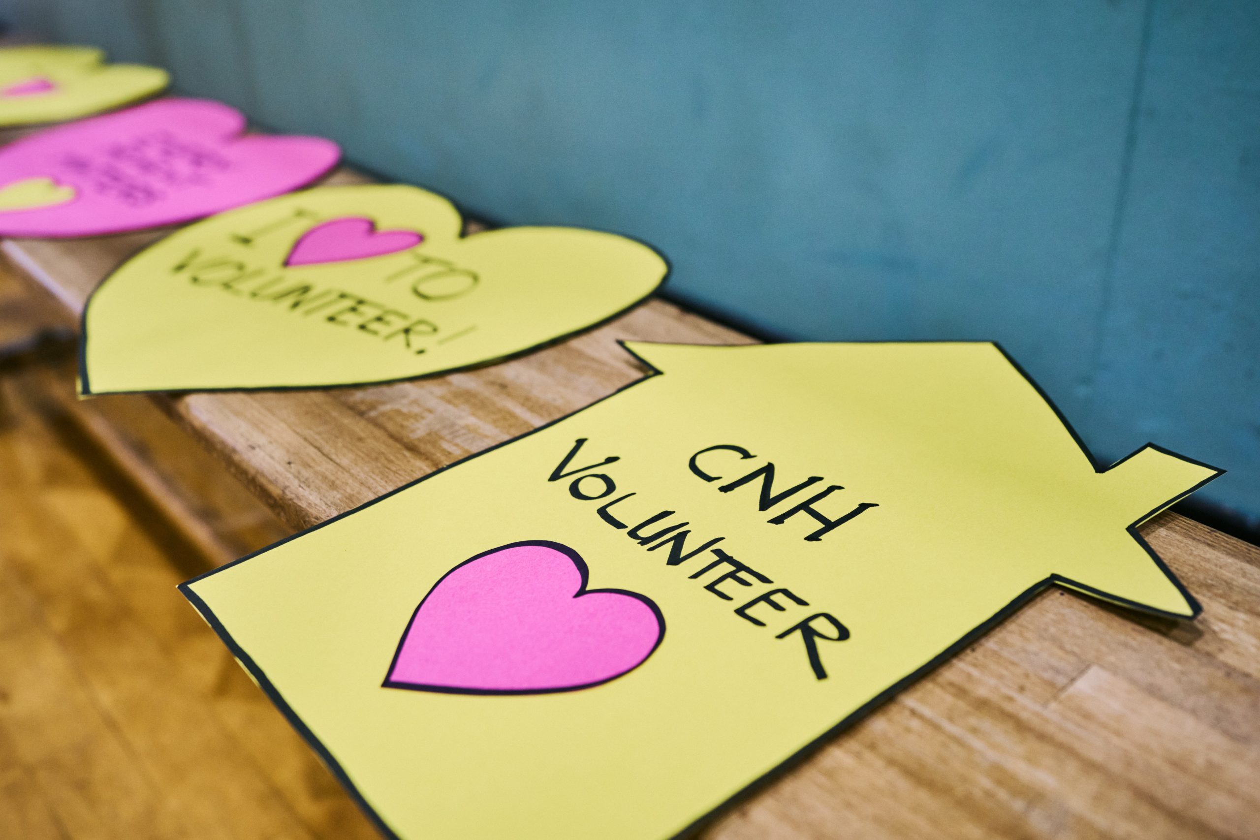 A paper cutout of a house with a heart on top